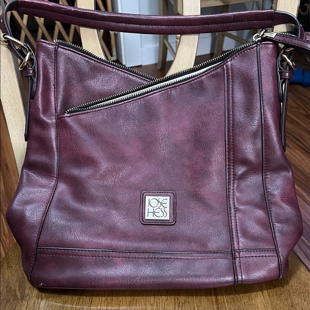 Jose Hess Signature Collection
Burgundy Leather Hobo Bag. No shoulder strap.